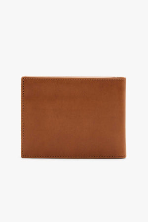A close-up image of the RMW Singleton Wallet with Coin Pouch, made from closed brown calf leather, against a plain white background. The wallet features a smooth texture and simple design, highlighted by visible stitching along the edges that offers sleek elegance.