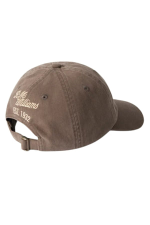The RM Williams Longhorn Twill Cap, shown from the back, has a brown adjustable strap and beige embroidered "R.M. Williams EST. 1932" text above the strap.