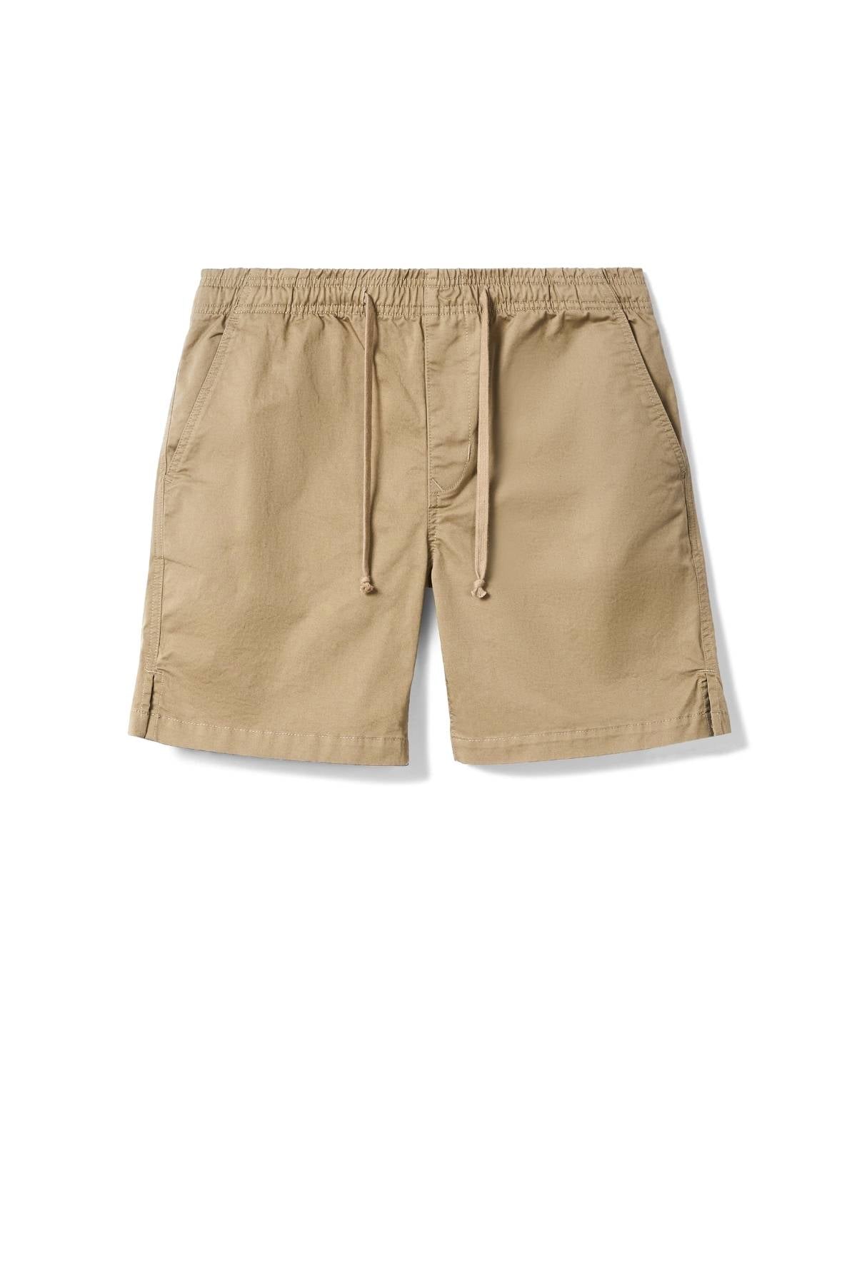 The RM Williams Washed Rugby Short in beige features an elasticated waistband with drawstring tie, branded embroidery, and front slanted pockets, displayed flat on a white background.
