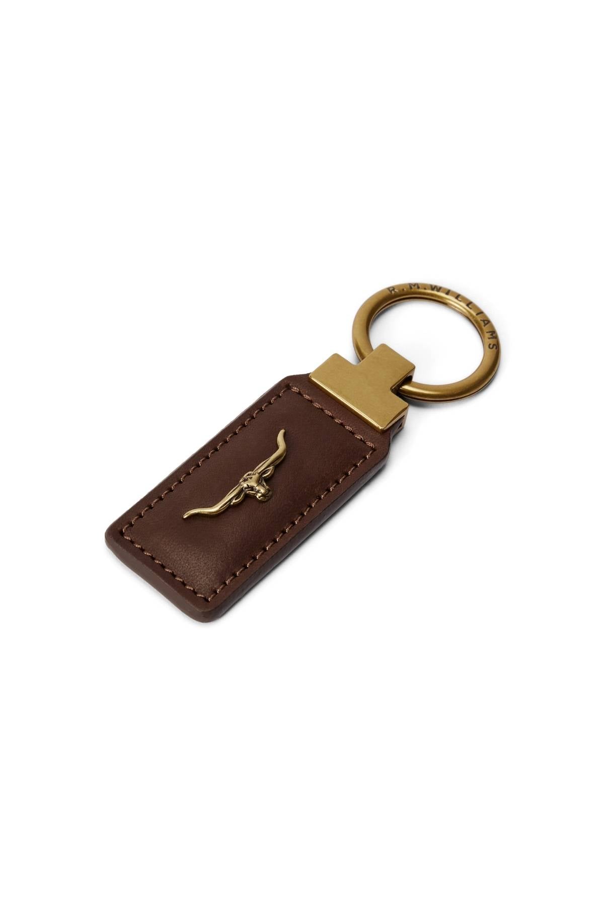 The RM Williams Angaston Key Fob is a brown leather keychain featuring a gold split keyring and a gold longhorn emblem elegantly embossed on the leather.