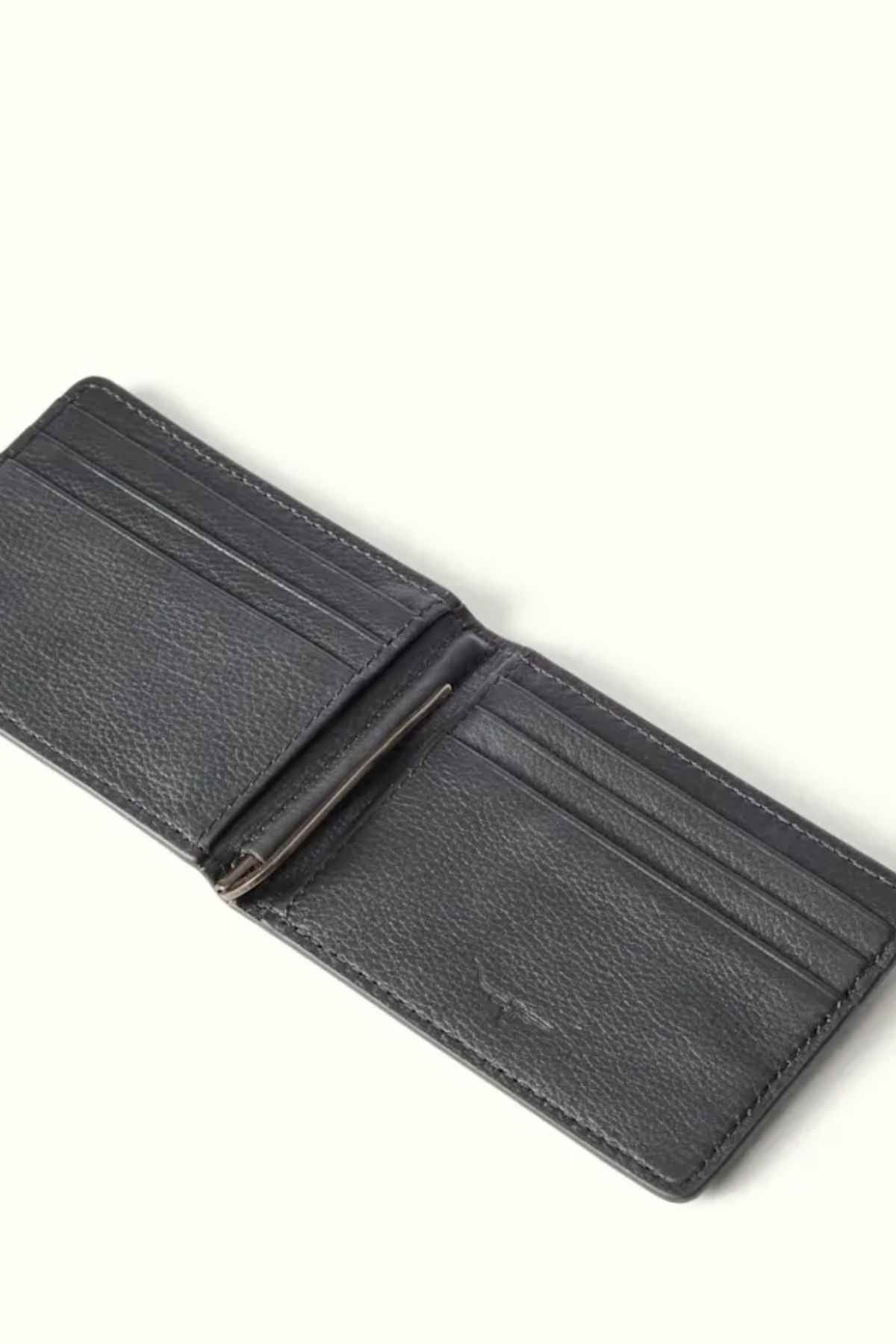 Displayed against a light background, the RM Williams Farrier Bi-Fold Wallet in black premium smooth leather reveals its interior, featuring multiple card slots on each side and showcasing its simple and elegant design.