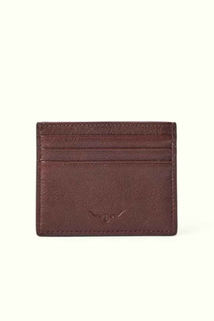 The RM Williams Farrier Card Holder is a brown card holder made from premium leather, featuring multiple horizontal card slots, subtle stitching, and an embossed logo at the center.