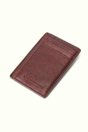 The RM Williams Farrier Cardholder with Money Clip is a premium leather accessory featuring a textured brown surface, multiple card slots, and subtle embossed text at the bottom.