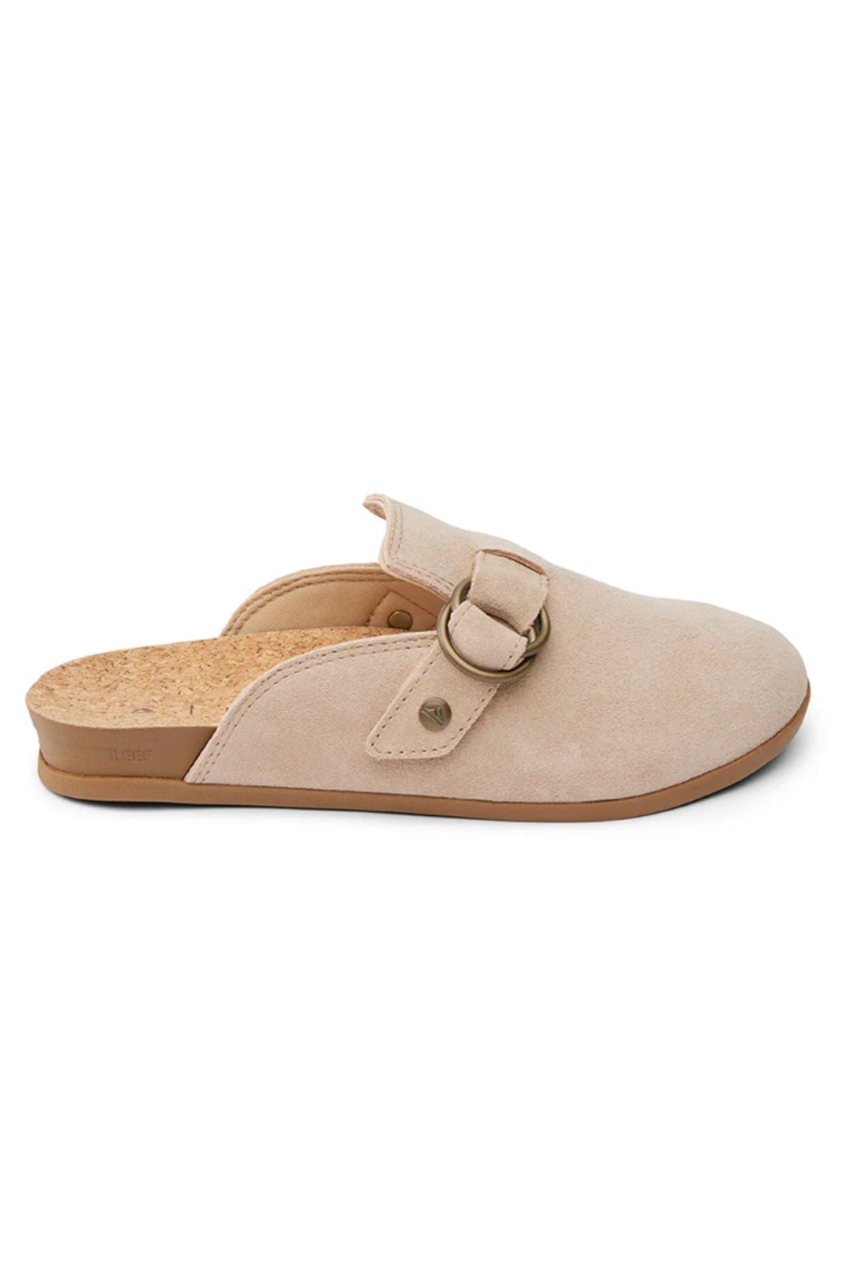The REEF Vista Serenity mule in beige suede offers a closed toe, open back, cork insole, and a decorative strap with a round metal buckleβideal for stylish and comfortable women's footwear.