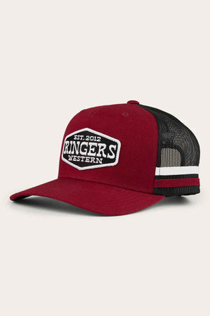 The Ringers Western Banks Trucker Cap features a robust cotton twill construction with a maroon and black design, complemented by a mesh back. It has a front patch displaying "Est. 2012 Ringers Western" and is finished with an adjustable snapback and a white stripe at the back for a timeless appearance.