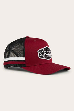 The Ringers Western Banks Trucker Cap showcases a maroon color with a black mesh back, complemented by an embroidered patch. Crafted from sturdy cotton twill, it features a white and green striped detail on the side. Its adjustable snapback guarantees a perfect fit for all wearers.