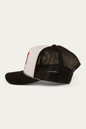The Ringers Western Bout A Truck Trucker hat is shown from the side, featuring a curved black brim, white front panel with red and black graphics, and a breathable black mesh back.