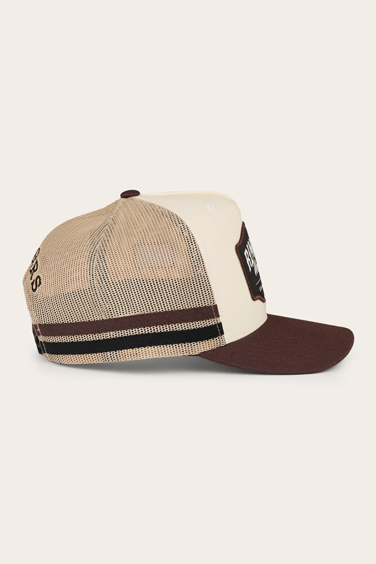 The Ringers Western Country Club Deep Fit Trucker Cap features a beige and brown design with a mesh back, solid front panel, brown visor, rectangular front patch, black and brown side stripes, and an adjustable snapback for comfort.