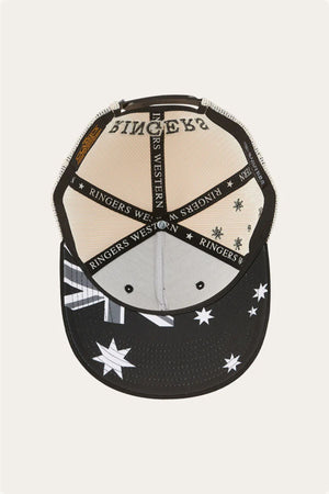The Ringers Western Country Club Deep Fit Trucker Cap in black and beige is shown from above, featuring mesh panels, branded lining, and a black cotton twill brim with white stars and stripes.