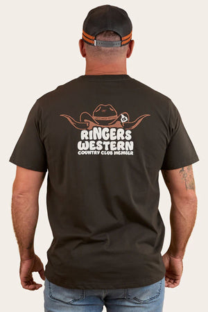 A man, seen from behind, wears a Ringers Western Country Club Loose Fit T-Shirt and cap. The tee has a cowboy hat with horns graphic and "RINGERS WESTERN COUNTRY CLUB MEMBER" text on the back.