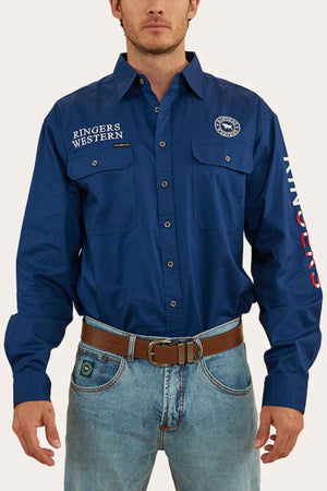 A man stylishly pairs the Ringers Western Hawkeye Flag Embroidered Shirt with blue jeans and a brown belt.