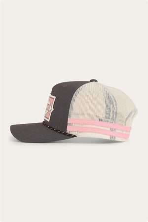 The Ringers Western Hometown Trucker Cap features a dark gray front, cream mesh back, pink and cream front patch, pink stripe detail, and an adjustable snapback for a perfect fit.
