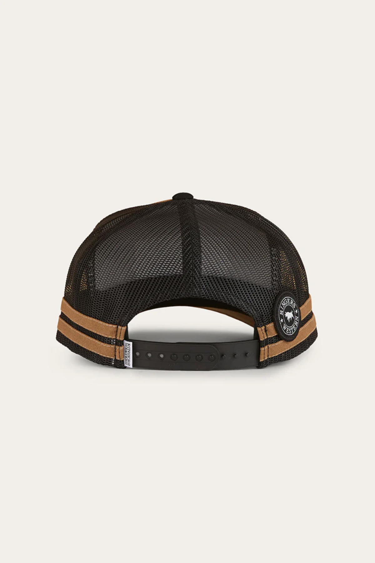 The Ringers Western Hometown Trucker Cap is shown from the back in black mesh, featuring an adjustable snapback closure, two tan horizontal stripes, and a round patch near the closure.