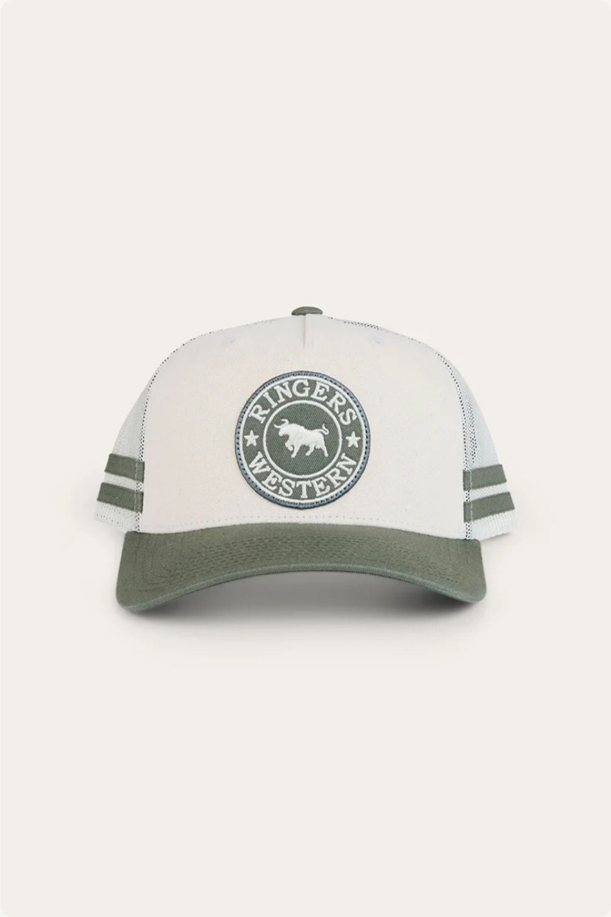 The Ringers Western McCoy Trucker Cap is a light grey and olive green cotton twill cap featuring "Ringers Western" and a bull logo embroidered on the front, two green side stripes, and an olive green brim.