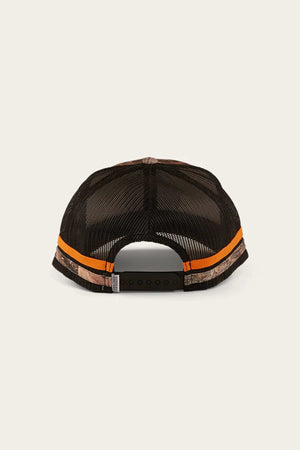 The Ringers Western McCoy Trucker Cap is a black mesh trucker cap with camo-patterned sides, two orange stripes on the back, and an adjustable snapback. It showcases the classic Ringers Western design on a light neutral background and is made from premium cotton twill for durability and style.