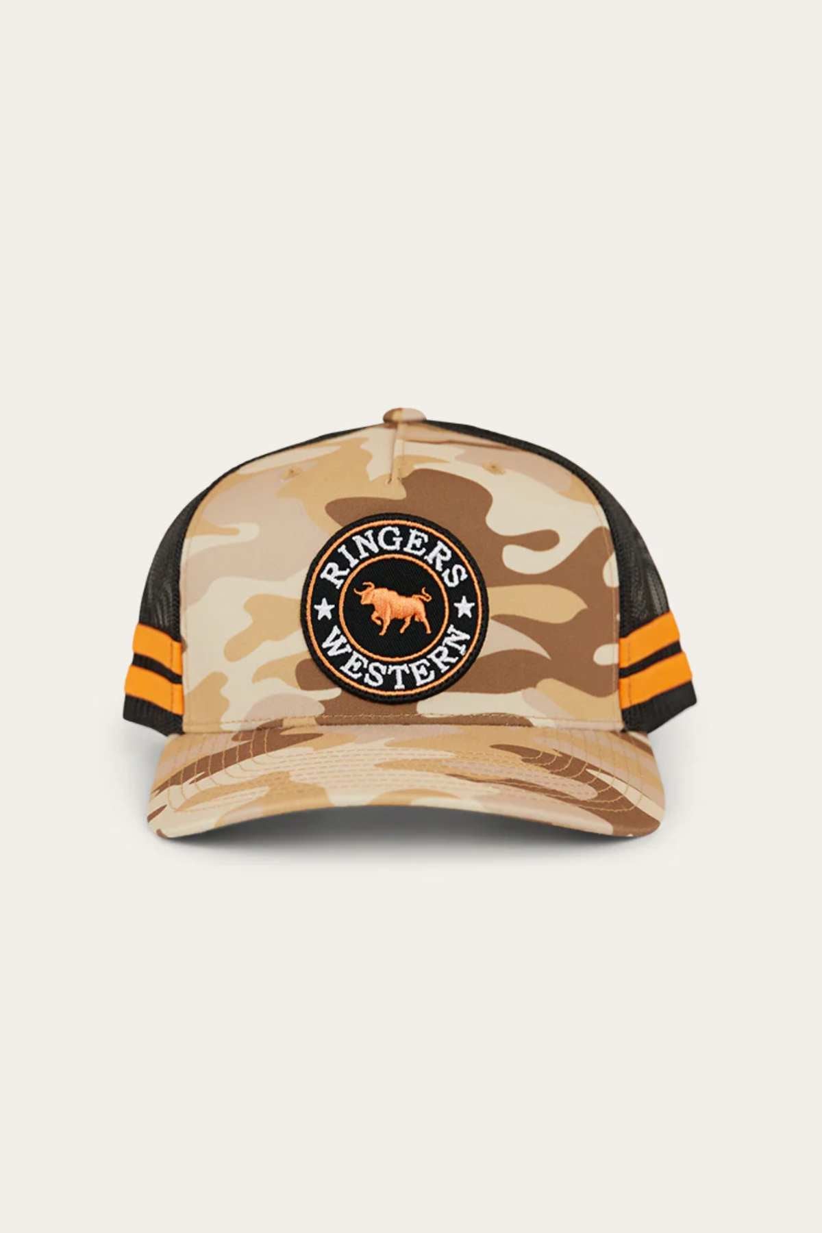 The Ringers Western McCoy Trucker Cap features a camouflage design, mesh back, orange and black stripes on the sides, and a circular front patch with a bull and "Ringers Western" branding.