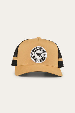The Ringers Western Pendleton Trucker Cap is a tan and black hat with an adjustable snapback. It features a circular embroidered badge on the front that reads "Ringers Western" around an emblem of a cow. The cap also includes black mesh back panels for ventilation.