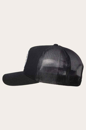 Side view of the Ringers Western Signature Bull Trucker Cap, featuring a curved brim and cotton twill front panel in black. The mesh back enhances the solid black design, set against a light beige background.