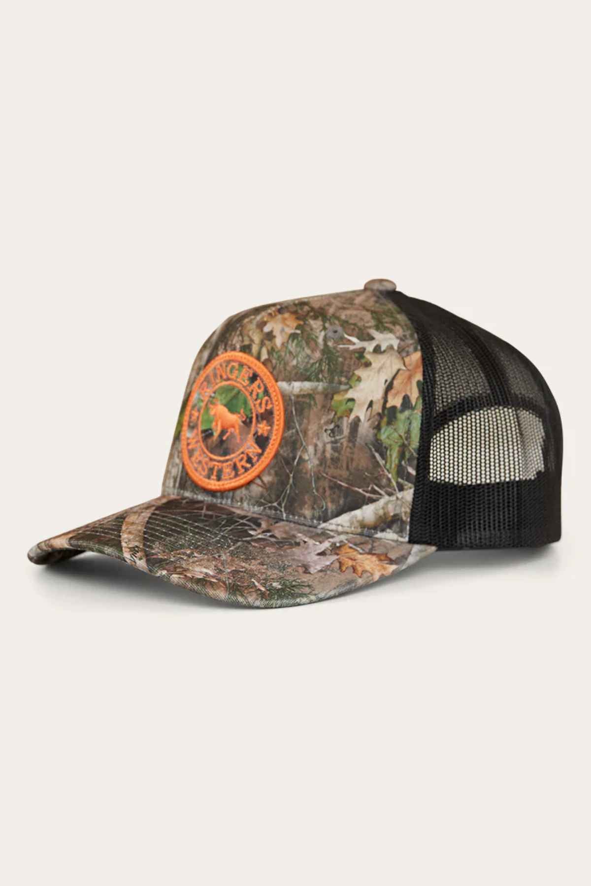 Introducing the Ringers Western Signature Bull Trucker Cap: a camouflage cap with a black mesh back, crafted from durable cotton twill. The front proudly displays an orange circular patch featuring a deer and the words "Ranger's Hunter," combining rugged style with outdoor spirit—ideal for fans of Ringers Western.