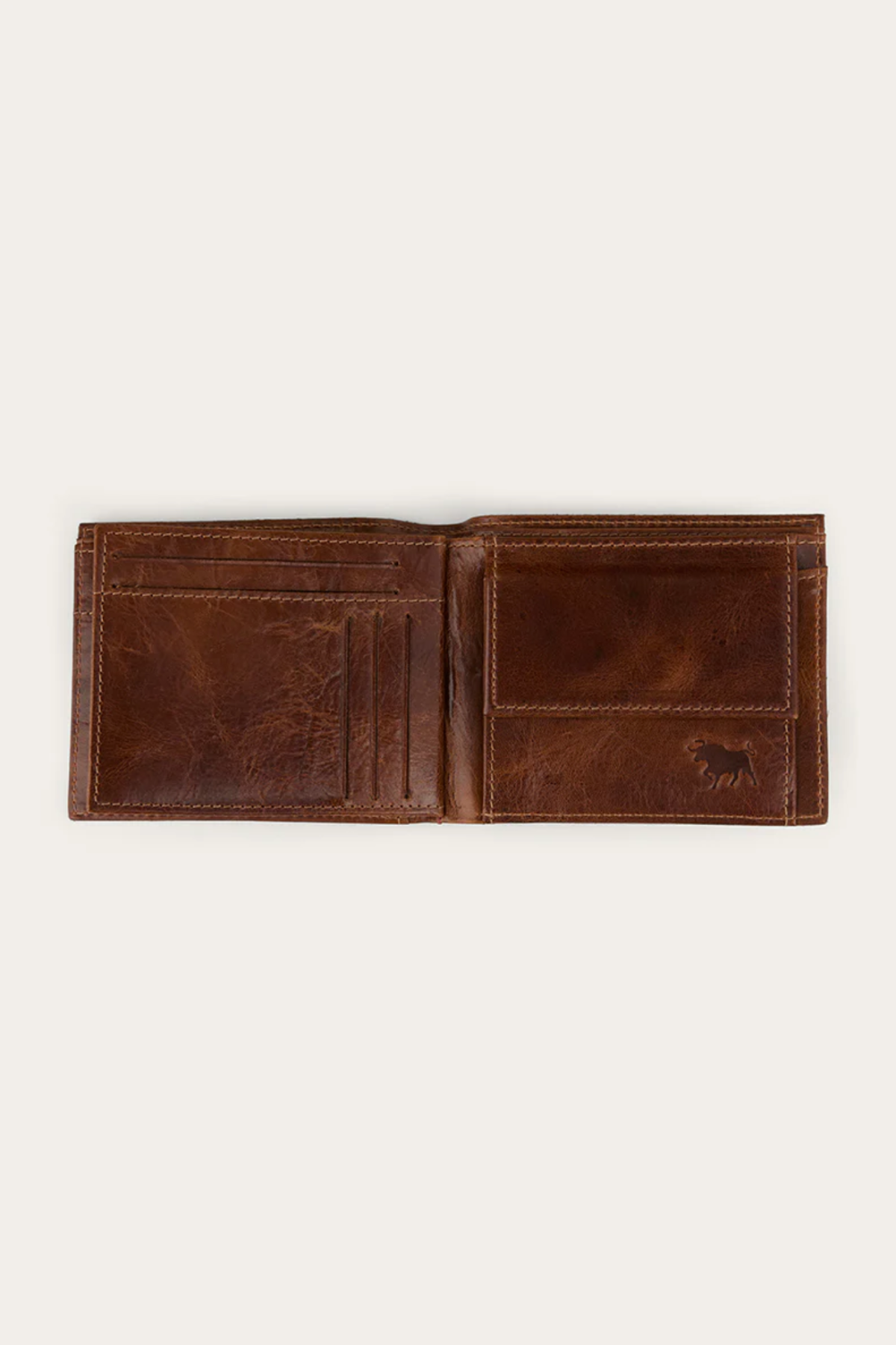 The Ringers Western Toro Grande Wallet, crafted from full grain leather, features multiple card slots on the left and a coin pocket on the right. Displayed against a plain light background, it blends classic style with daily functionality.