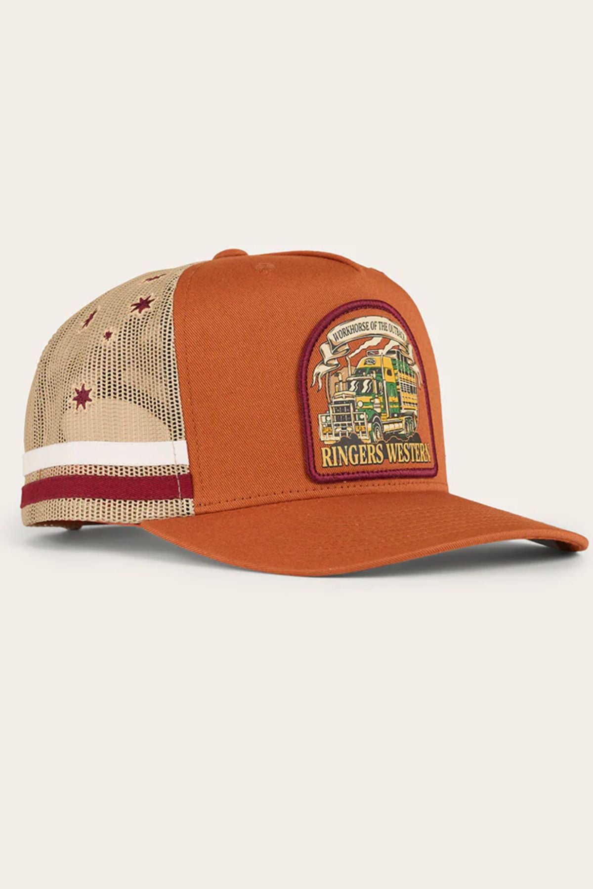 The Ringers Western Workhorse Trucker Cap features classic trucker style with an orange and beige mesh back, white and red stripes, red stars, a “Ringers Western” patch with a bus—ideal for sun protection.