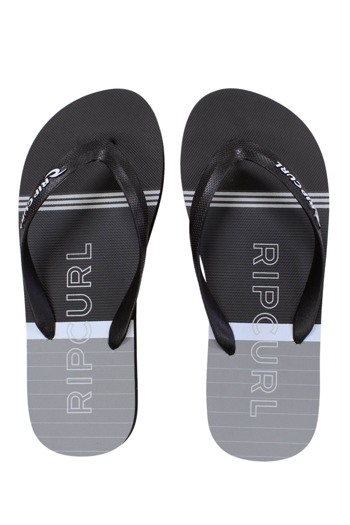 A pair of Rip Curl Breakers Bloom Thongs in black and gray, featuring white horizontal stripes, a vertical "RIP CURL" logo on the soles, black straps with the white Rip Curl logo, and an ergonomic design for comfort.