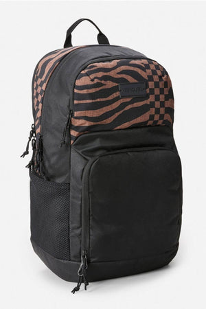 Meet the Rip Curl Chaser 33L Backpack, made from recycled polyester. This black bag features a brown and black checkered top, large front pocket, side mesh pockets, multiple zippers, and a top handle. Perfect for students or travelers seeking style and convenience.