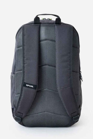 The Rip Curl Chaser 33L Backpack in gray is shown from the back, highlighting its padded shoulder straps and textured design. This fashionable backpack, crafted from recycled polyester, blends functionality with eco-friendly features for the mindful traveler.