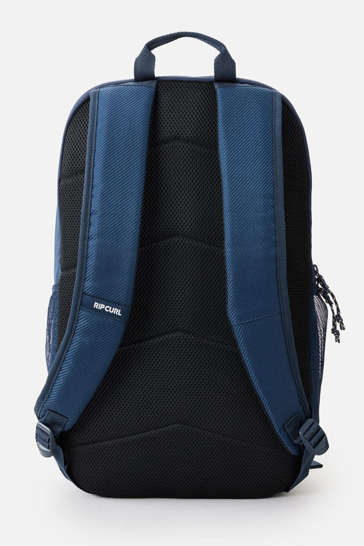 The Rip Curl Chaser 33L Backpack boasts a stylish navy blue and black design made from recycled polyester. It is equipped with padded shoulder straps and a top handle, making it ideal for daily use. The backpack also features a compartment that safely accommodates a 15" laptop, with the "RIP CURL" branding prominently displayed on the back panel.