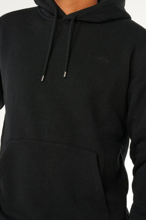 Model wearing the Rip Curl Classic Surf Hood in plain black with a front pocket and drawstrings, shown from shoulders to waist against a neutral background. The face is not visible.