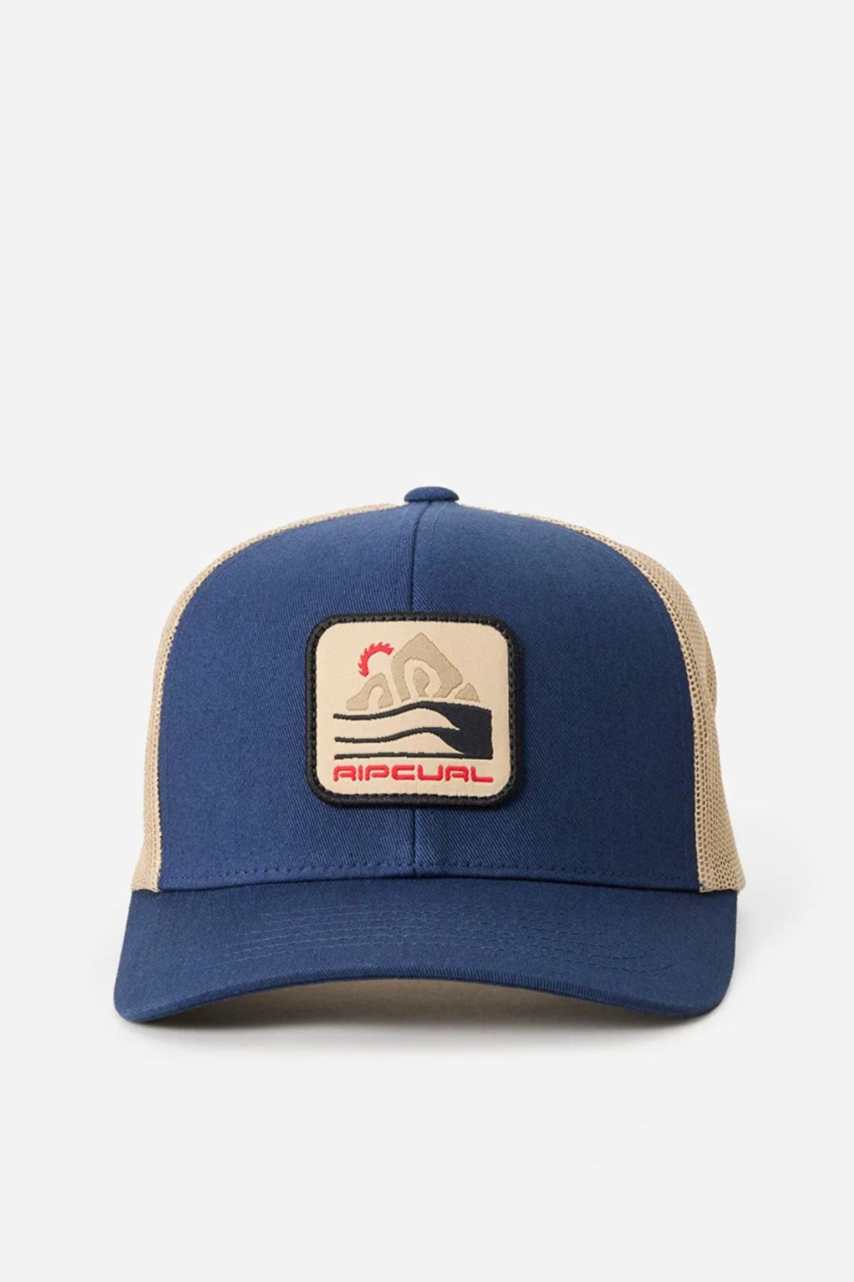 The Rip Curl Custom Curve Trucker is a blue and beige cotton twill hat with a curved peak, front patch of a surfer riding a wave, and "Ripcurl" below, shown on a plain white background.