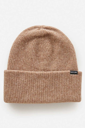 The Rip Curl Eclipse Tall Beanie is a ribbed, light brown acrylic knit with a folded brim and small black side label, shown on a white background—an ideal addition to any winter wardrobe.
