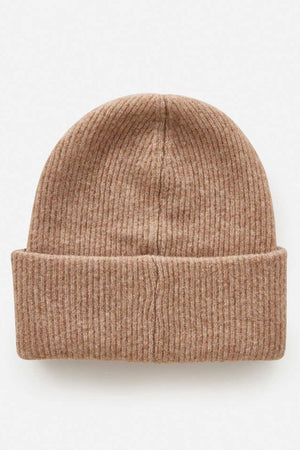 The Rip Curl Eclipse Tall Beanie is a ribbed, light brown knit hat made from soft acrylic yarn with a folded cuff, shown flat on a light background—an ideal addition to any winter wardrobe.