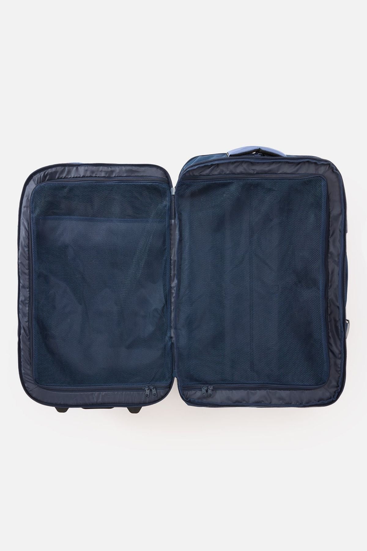 The Rip Curl F-Light Global 100L Cosmic Kiss Wheeled Travel Bag is shown open and empty on a white background, laid flat to display its navy blue AirTag-compatible interior compartments and mesh divider panels.