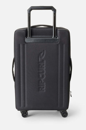 The Rip Curl F-Light 90L Check-In Wheeled Travel Bag is a stylish black hard-shell suitcase with four wheels, an extended telescopic handle, and embossed "RIP CURL" logo—ideal practical luggage for your journeys.