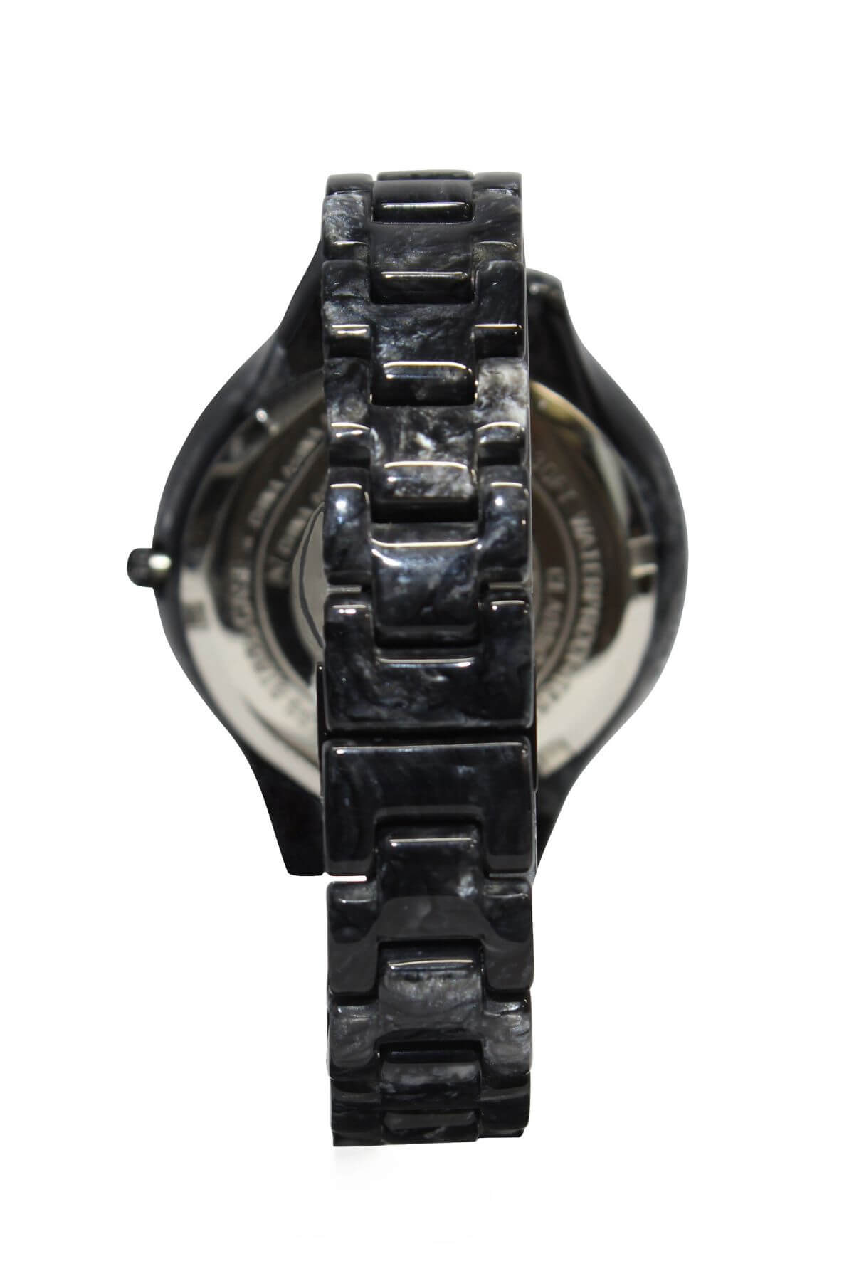 A close-up of the Rip Curl Horizon Acetate watch shows a shiny, segmented black strap with a textured finish. The metallic back is partially visible. This timepiece features a unique pattern, glossy appearance, and has a water resistance rating of 100m/330ft.