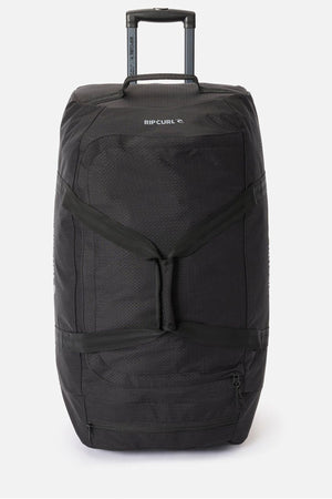 A large black Rip Curl Jupiter 80L travel bag with a telescopic handle, front zip pocket, reinforced handles, and inline skate wheels, shown on a plain white background.