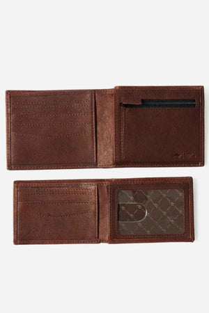The Rip Curl K-Roo RFID 2 in 1 Wallet, meticulously crafted from smooth, polished kangaroo leather, features an open design with multiple card slots, a transparent ID slot, and a small zippered compartment. This slim wallet offers RFID protection alongside its simple, classic design.