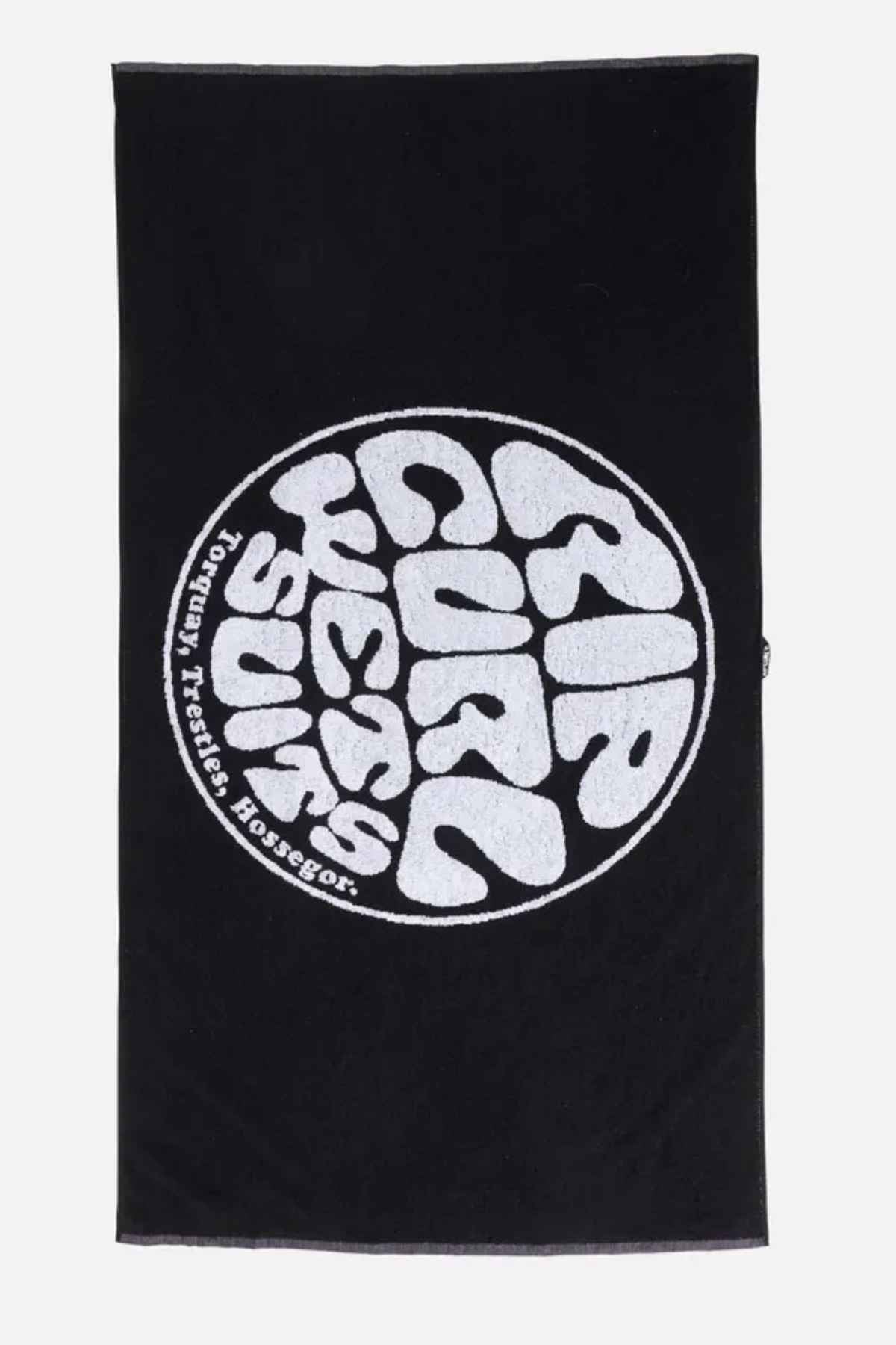 Presenting the Rip Curl Logos Towel in black, ideal for beach outings. This towel features a circular pattern with elegantly wavy white text: "Rip Curl, Surf, Torquay, Trestles, Hossegor." Crafted from high-quality cotton for ultimate softness and luxury.