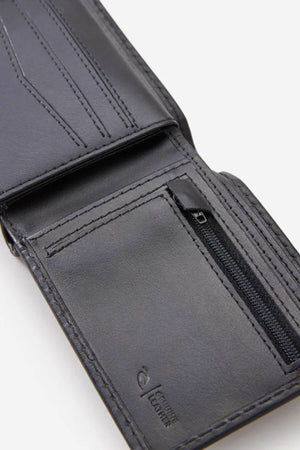 The Rip Curl Marked RFID All Day Wallet, made from black sheep nappa leather, offers multiple card slots, a zippered coin pocket, and detailed stitching. Inside, "100% genuine leather" is embossed in the bottom right corner.