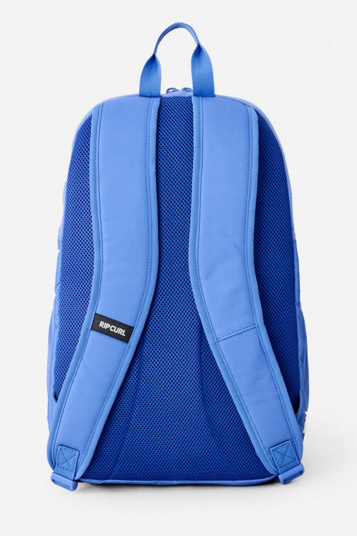 The Rip Curl Ozone 2.0 30L Backpack in blue is shown from the back with two padded shoulder straps, mesh back padding, and a small "Rip Curl" logo on one strap, set against a plain white background.