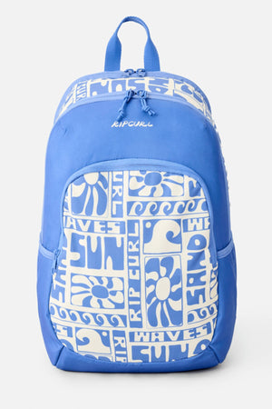 The Rip Curl Ozone 2.0 30L Backpack is blue with a white wave, sun, and "Rip Curl," "SUN," and "WAVES" graphic on the front pocket and top. This sustainable bag has a top handle and front zip pocket.