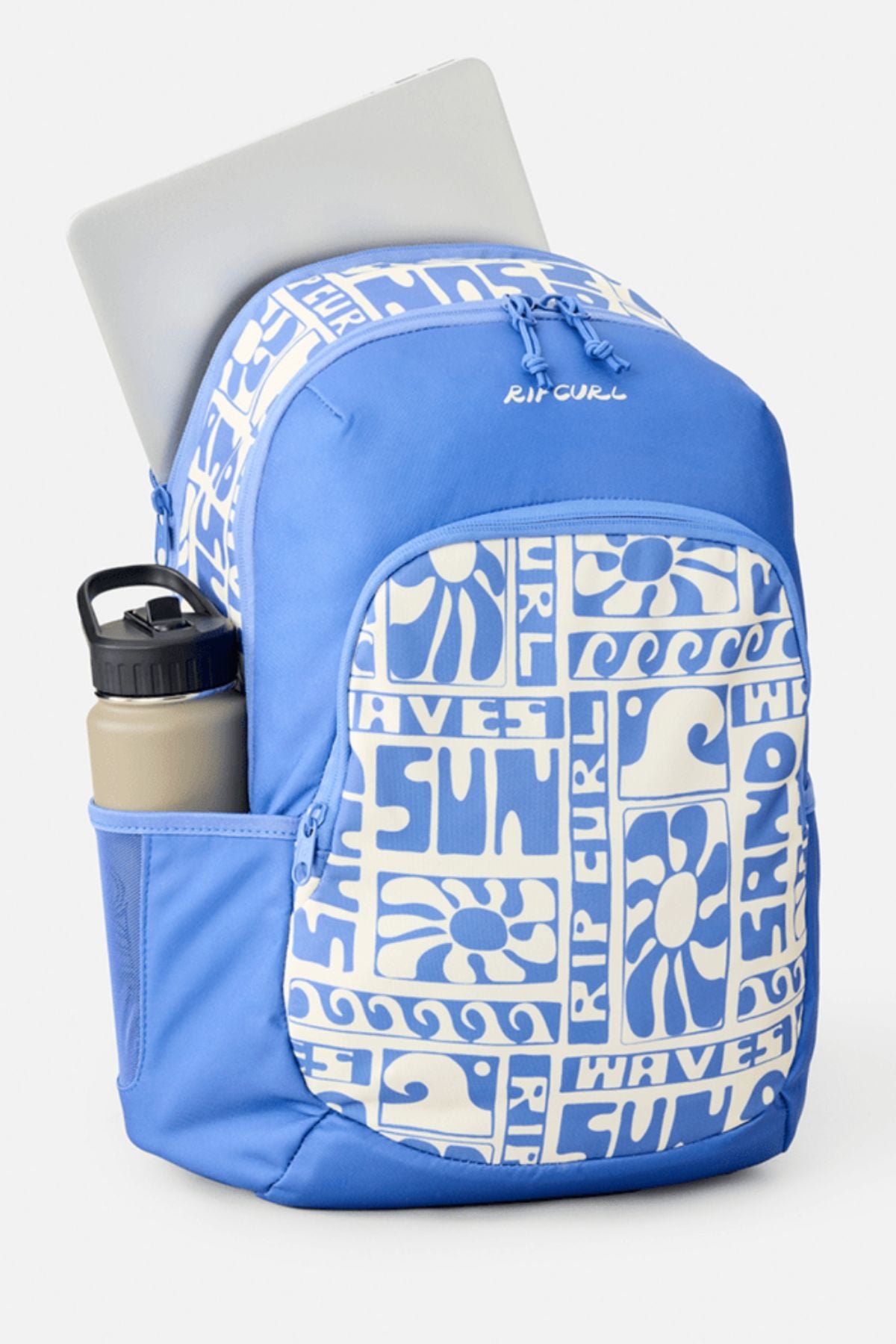 The Rip Curl Ozone 2.0 30L Backpack is blue with white graphic patterns, featuring a large front pocket, side water bottle pocket, and a laptop partly visible in the main compartment.