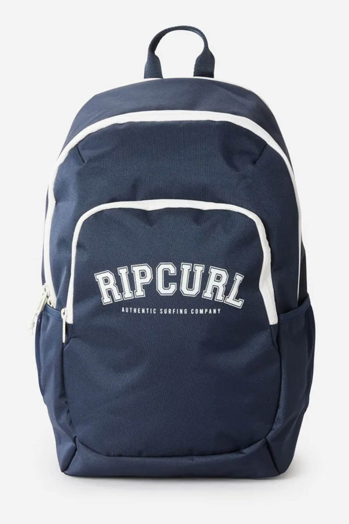 The Rip Curl Ozone 2.0 30L Backpack is navy blue with white accents, made from recycled polyester. It has "RIP CURL AUTHENTIC SURFING COMPANY" on the front, a top handle, laptop section, front zip pocket, and side pockets.
