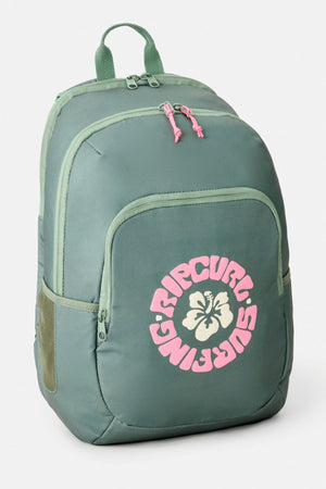 The Rip Curl Ozone 2.0 30L Backpack is green, with a pink zipper pull, a front pocket displaying a pink and white "Rip Curl Surfing" logo with hibiscus flowers, multiple compartments, and a top handle.