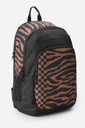 The Rip Curl Ozone 2.0 30L Backpack features a spacious black design with brown and black tiger stripes, a checkerboard front pocket accent, organiser pockets, multiple zippers, and a top carrying handle.