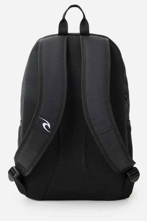 The Rip Curl Ozone 30L Back To School Backpack is designed for school or travel, featuring padded shoulder straps with a small logo on the left strap. It includes a breathable mesh back panel and a convenient carrying handle on top, making it both functional and stylish.
