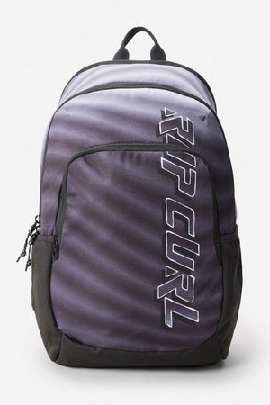 The Rip Curl Ozone 30L Faded Slant Backpack features a sleek black and gray design with bold white branding, a main compartment with a laptop section, front pocket, breathable straps for comfort, and a sturdy top handle.