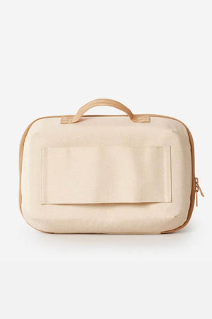 The Rip Curl Ultimate Beauty Case is a beige rectangular bag crafted from recycled polyester, featuring a top handle, front flap pocket, right-side zipper, and internal mesh organiser, shown against a plain white background.
