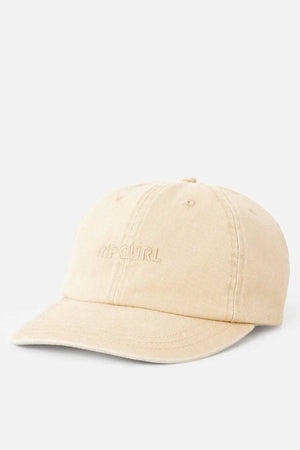 The Rip Curl Premium Surf Cap in light beige features “RIP CURL” embroidered on the front, ideal for outdoor adventures and shown against a plain white background.